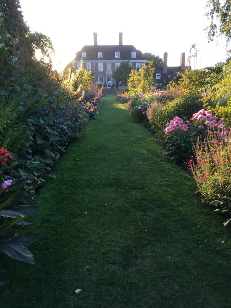 traditional long borders and Lutyens house