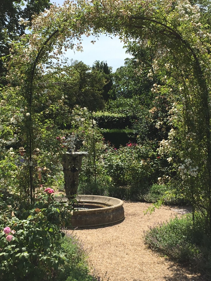 sundial and rose arches in the rose garden